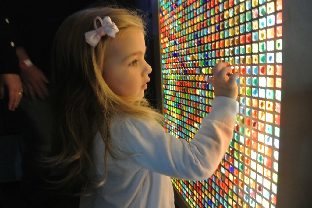Girl interacting with Sensory Color Marbles