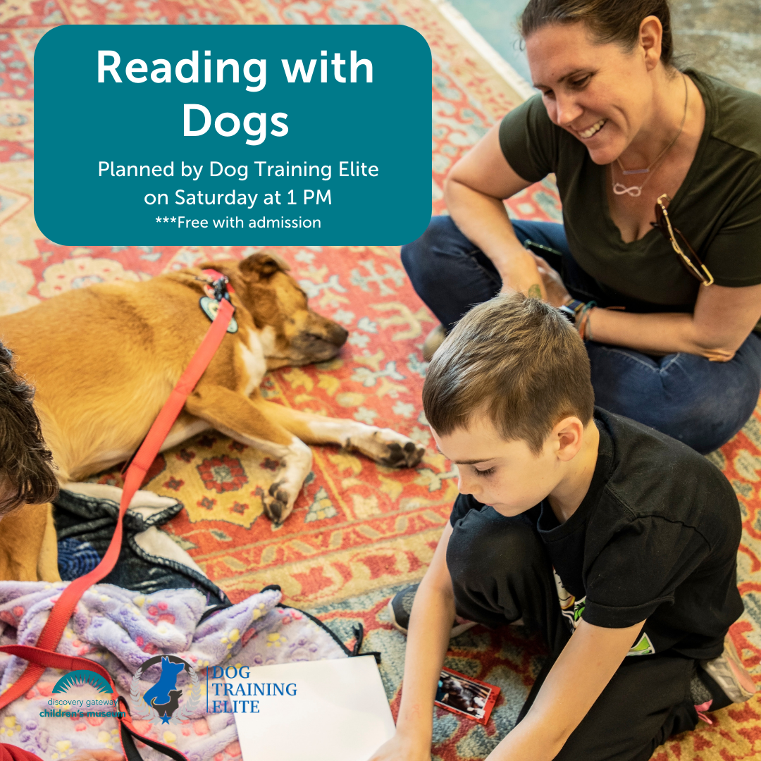 Boy and mother read books to a therapy dog