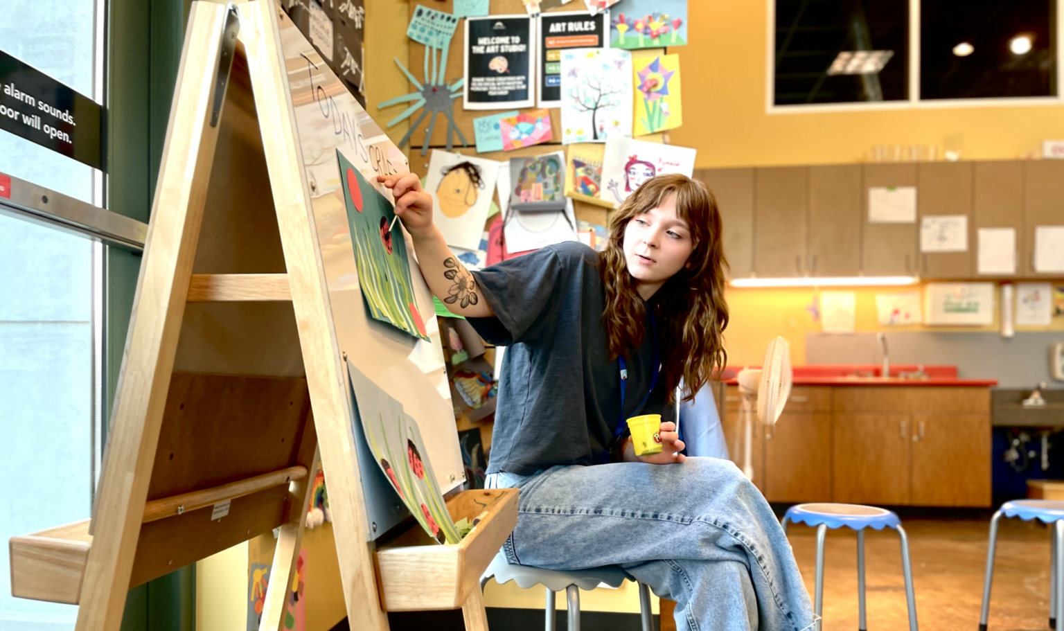 Art instructor demonstrate daily art program