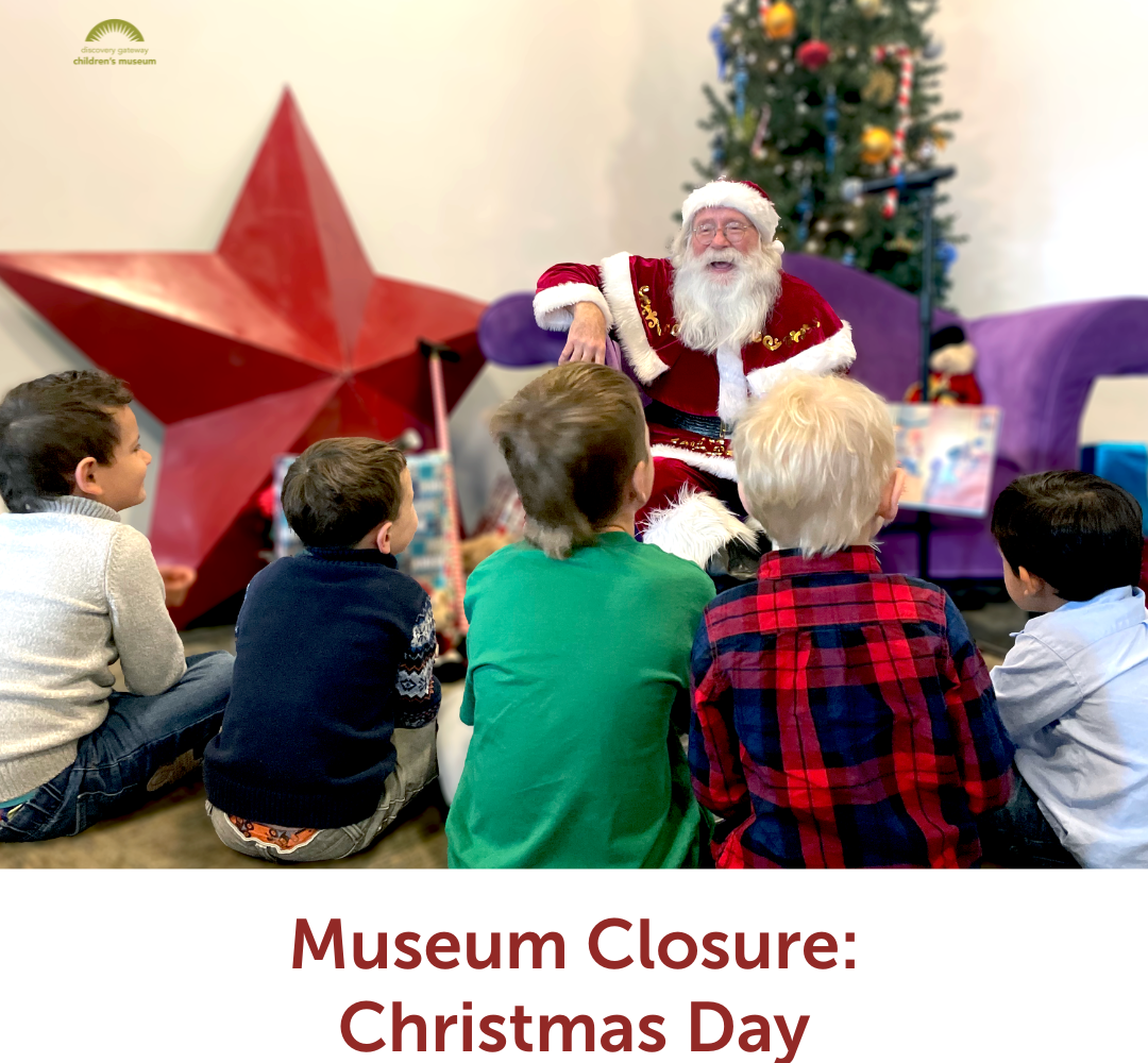 Santa reading stories to a group of kids