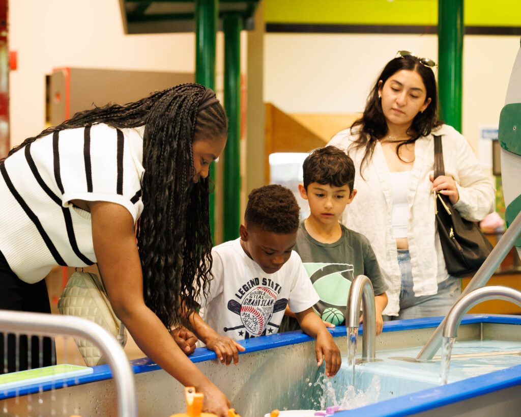 Families explore the Water Play exhibit at Discovery Gateway Children’s Museum in Salt Lake City.
